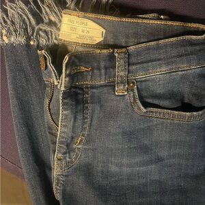 Free people frayed and ripped jeans
